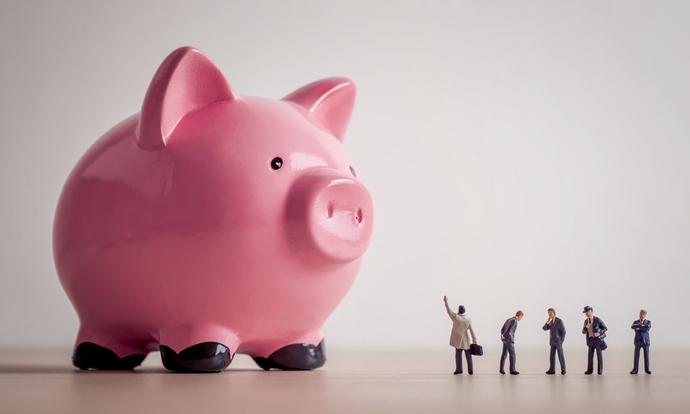 Payroll Outcourcing: Das Bild zeigt ein übergrosses, rosafarbenes Sparschwein.