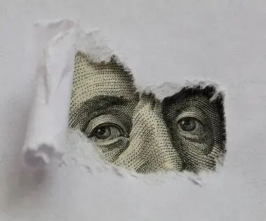 Mit Interim Management Finanz-Herausforderungen lösen: Das Bild zeigt den Kopf auf einer Dollar-Note.